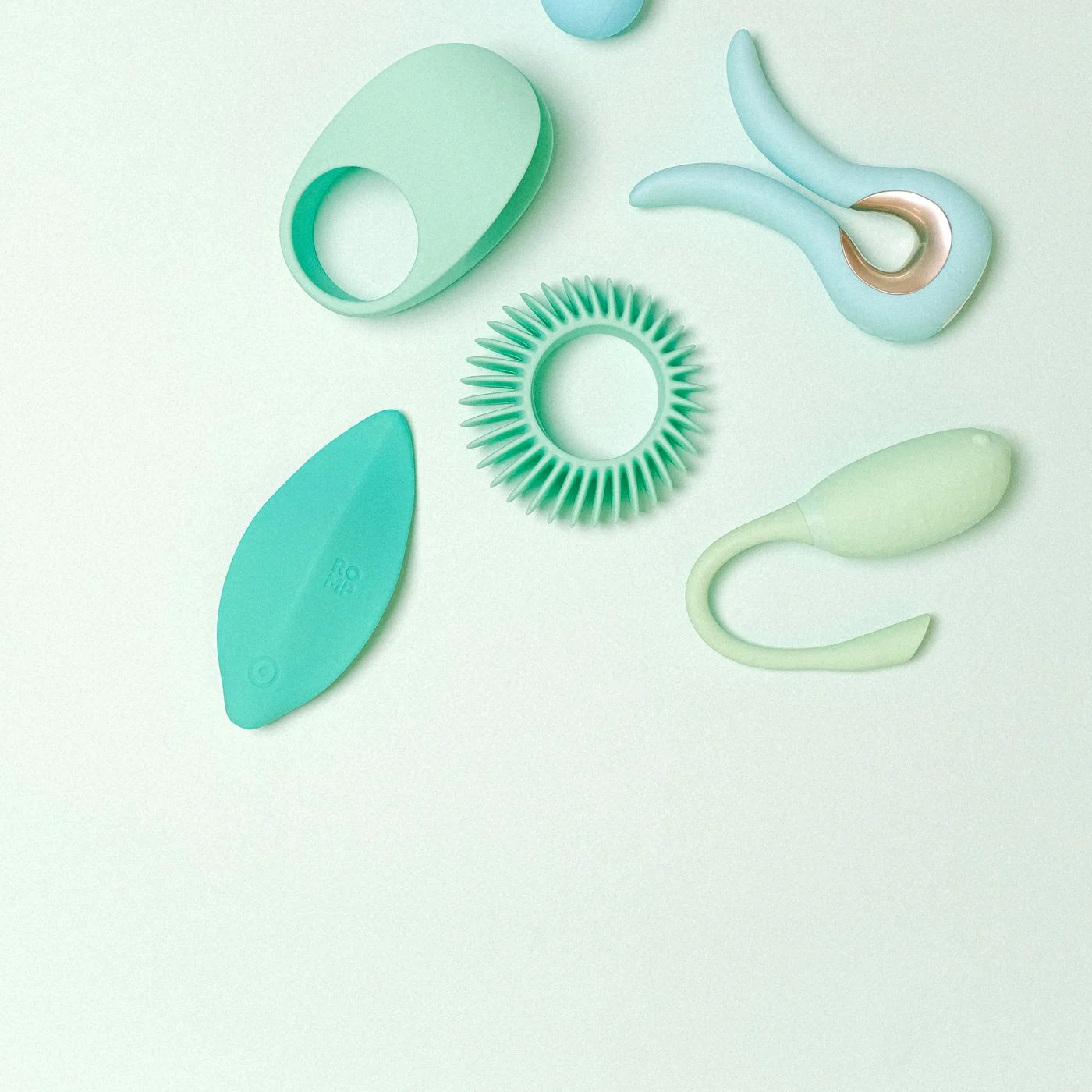Anal play products styled in a calm editorial composition