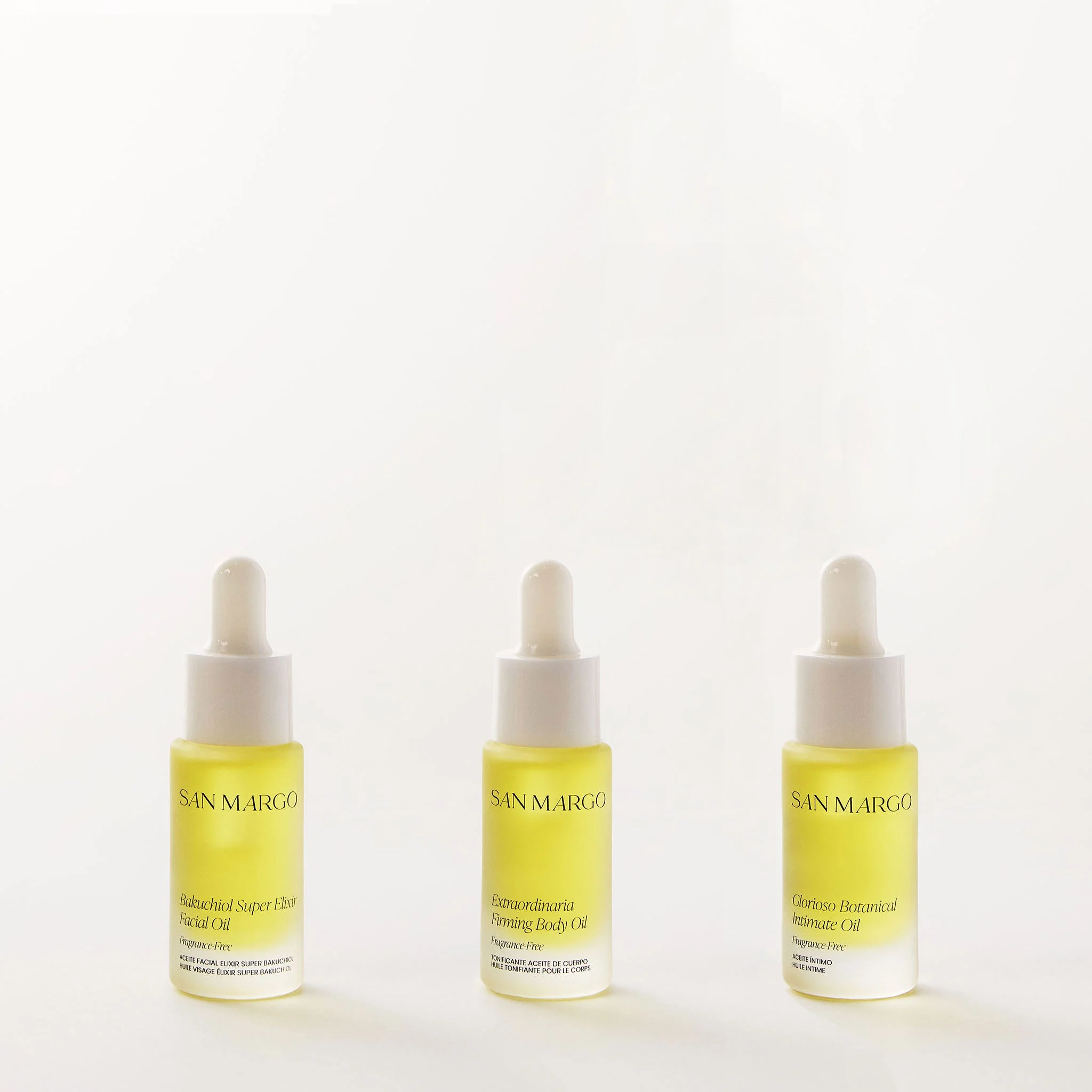 A row of botanical intimate care oil bottles